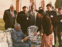 Neela presenting her book to Sri R. Venkataraman, President of India, in the lawns of Rashtrapati Bhawan, New Delhi